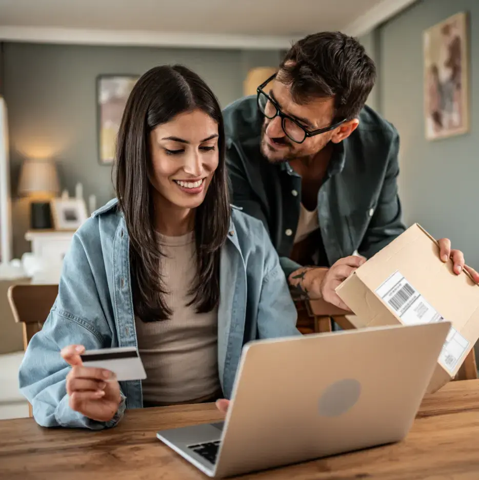 Couple online shopping with package