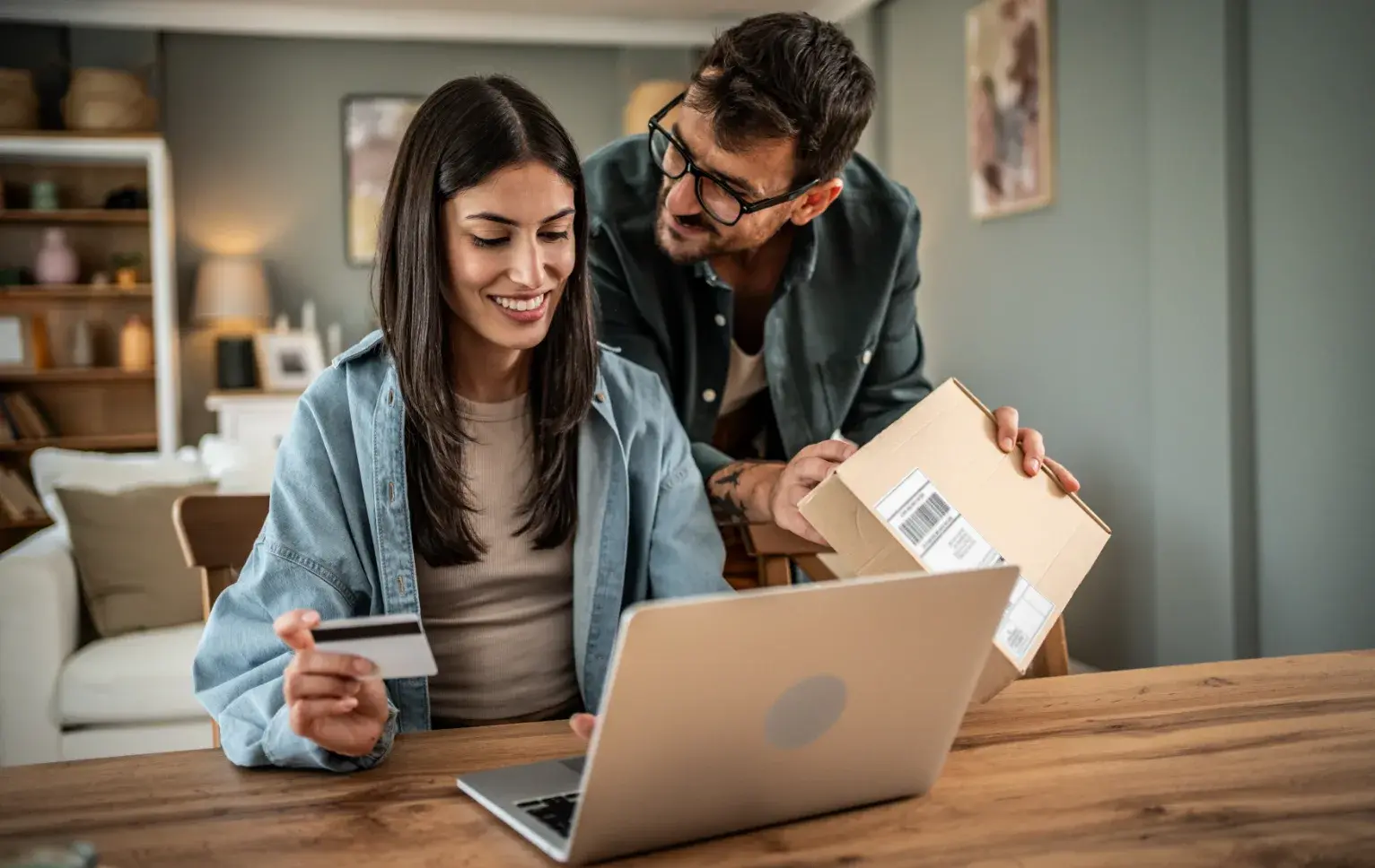 Couple online shopping with package